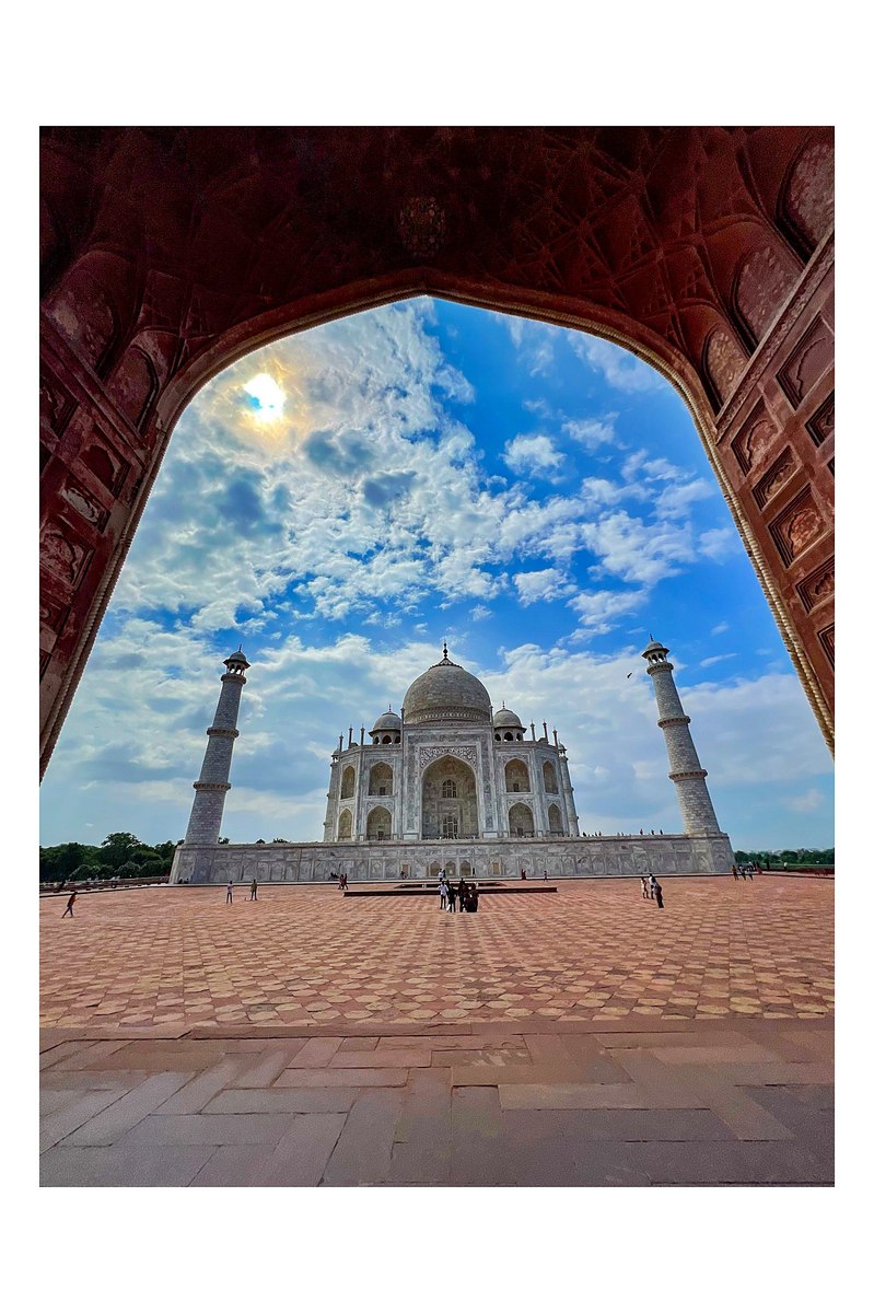 The Taj Mahal framed through the red sandstone gateway, Agra